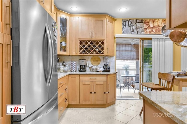 1854 73rd St, Brooklyn, NY 11204 - kitchen with freestanding refrigerator, decorative backsplash, glass insert cabinets, light tile patterned flooring, and light stone counters