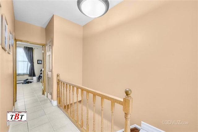 1854 73rd St, Brooklyn, NY 11204 - hallway featuring an upstairs landing, light tile patterned floors, and baseboards