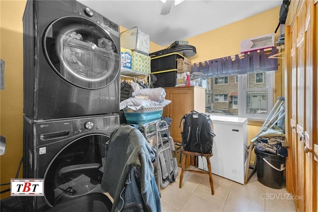 1854 73rd St, Brooklyn, NY 11204 - clothes washing area with estacked washer and dryer, light tile patterned floors, and ceiling fan