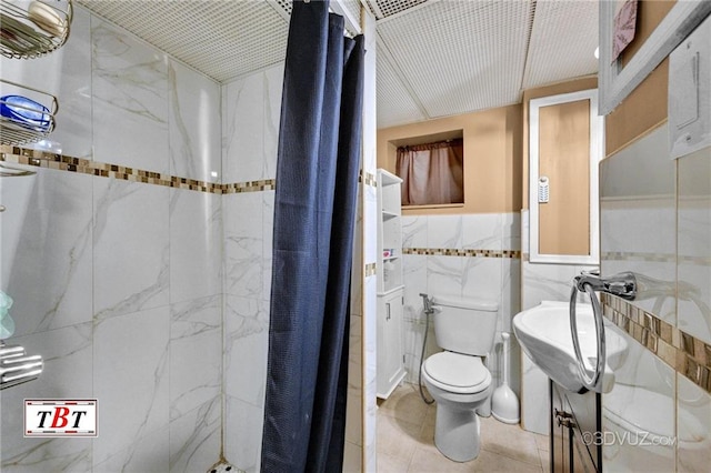 1854 73rd St, Brooklyn, NY 11204 - full bath featuring tiled shower, tile walls, toilet, a sink, and tile patterned floors