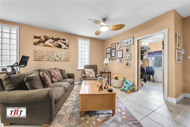 1854 73rd St, Brooklyn, NY 11204 - living area featuring a ceiling fan, a baseboard heating unit, light tile patterned flooring, and baseboards