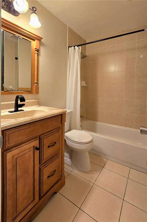 full bath with vanity, tile patterned floors, shower / bath combination with curtain, and toilet