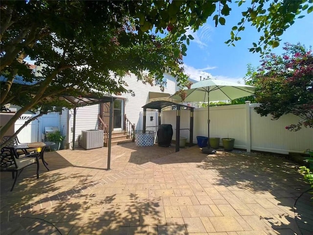 view of patio / terrace with central air condition unit, a pergola, fence, and entry steps