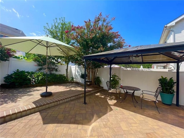 view of patio / terrace featuring a gazebo and a fenced backyard