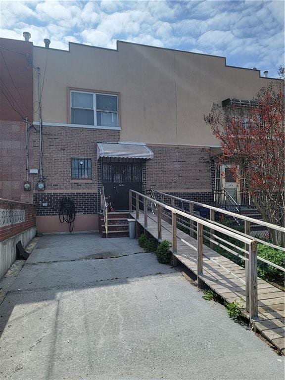 2878 W 31st St, Brooklyn, NY 11224 - view of front of house with stucco siding and brick siding