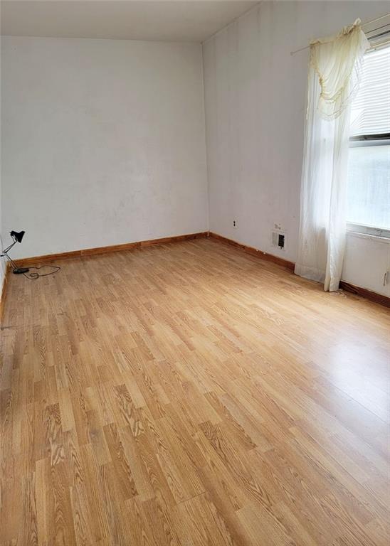 2878 W 31st St, Brooklyn, NY 11224 - unfurnished room with light wood-style floors and baseboards