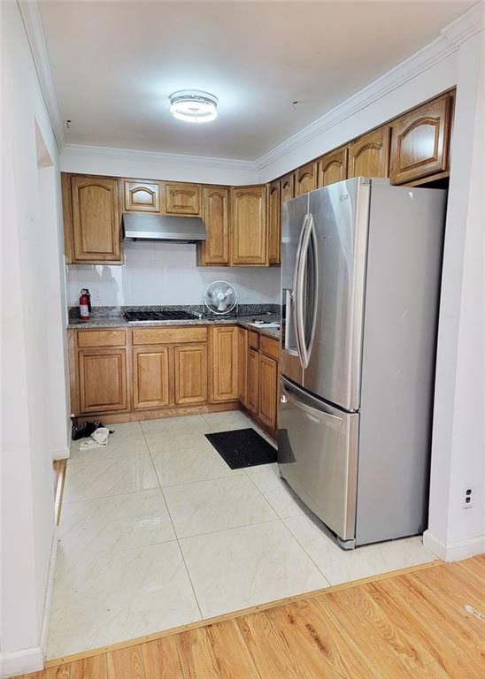 2878 W 31st St, Brooklyn, NY 11224 - kitchen with stainless steel refrigerator with ice dispenser, under cabinet range hood, black gas cooktop, crown molding, and brown cabinets