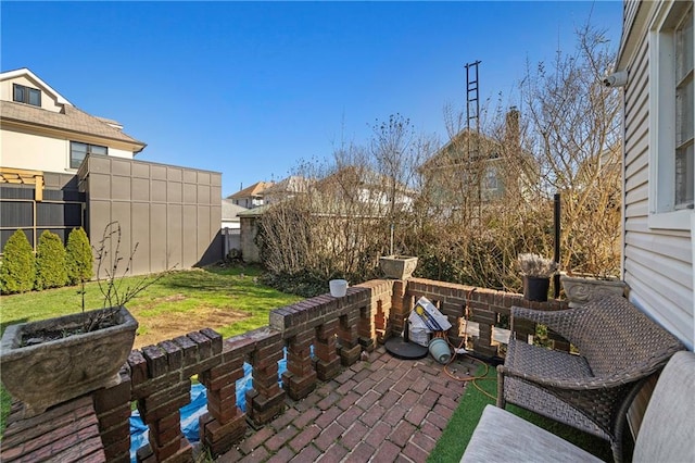 view of patio featuring fence