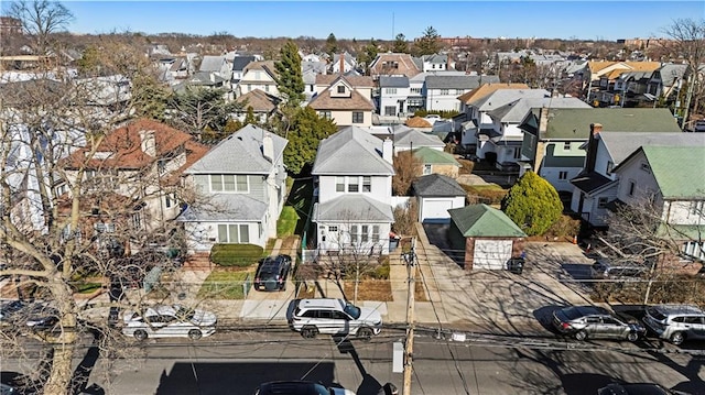 birds eye view of property with a residential view