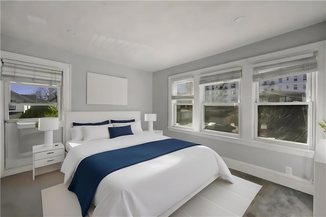 bedroom featuring baseboards