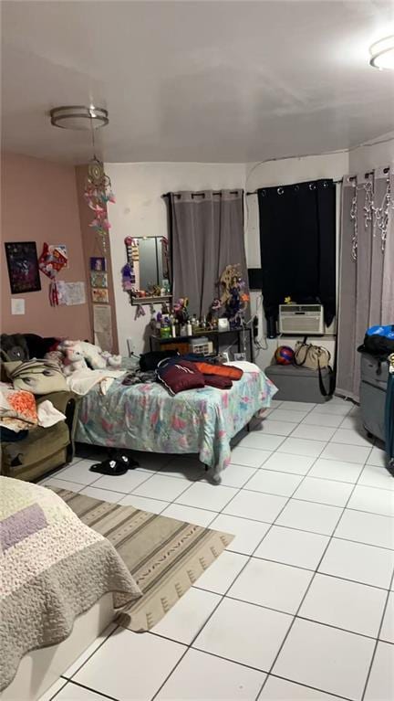 bedroom featuring light tile patterned flooring and cooling unit