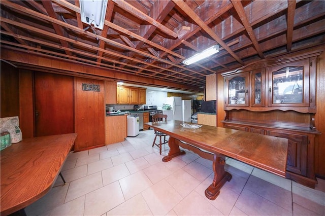 dining space with wooden walls