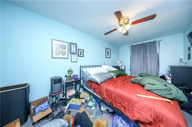 carpeted bedroom featuring ceiling fan