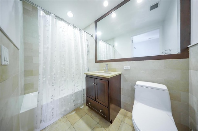 full bath featuring visible vents, tile patterned flooring, shower / bath combo, vanity, and toilet
