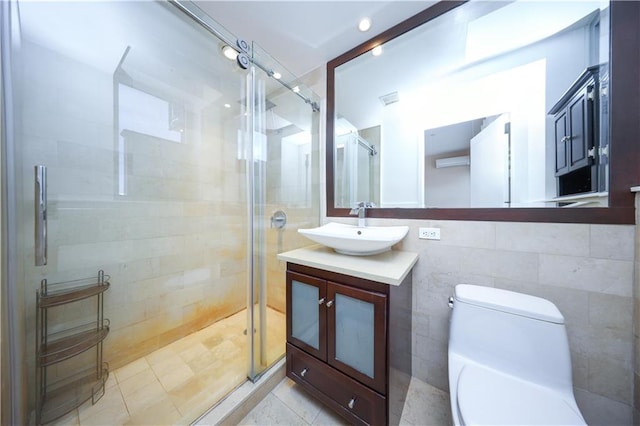 bathroom featuring a stall shower, toilet, and vanity