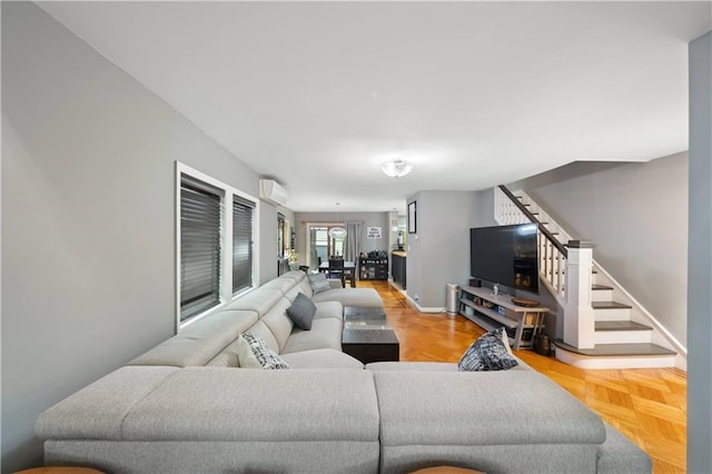 1942 Kimball St, Brooklyn, NY 11234 - living room featuring a wall unit AC, stairway, and baseboards