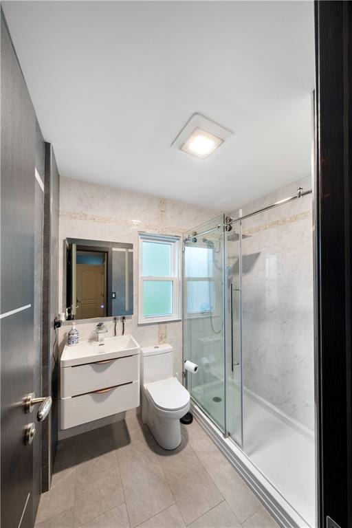 1942 Kimball St, Brooklyn, NY 11234 - bathroom featuring vanity, toilet, a shower stall, and tile patterned floors