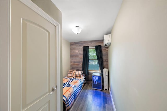 1942 Kimball St, Brooklyn, NY 11234 - bedroom with a wall mounted air conditioner, dark wood-style floors, wood walls, and radiator