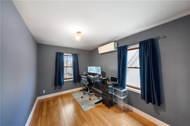 1942 Kimball St, Brooklyn, NY 11234 - office area with a wall mounted AC, wood finished floors, and baseboards