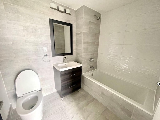 70-09 45th Ave Unit 7C, Woodside, NY 11377 - full bathroom with tiled shower / bath combo, tile walls, toilet, tile patterned floors, and vanity