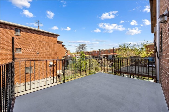 view of patio featuring a balcony