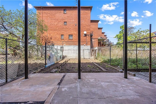 view of patio featuring fence