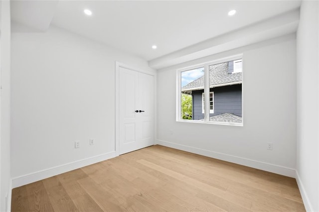 227 77th St, Brooklyn, NY 11209 - unfurnished bedroom featuring wood finished floors, recessed lighting, and a closet