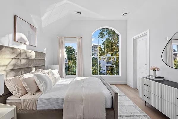 227 77th St, Brooklyn, NY 11209 - bedroom featuring wood finished floors and vaulted ceiling