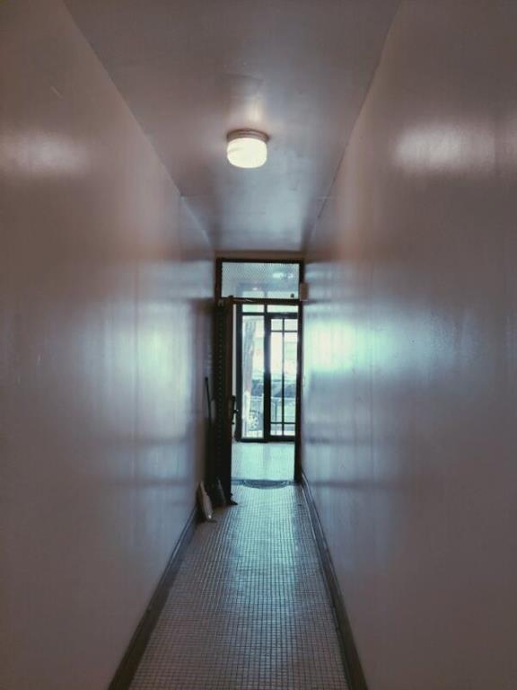 hallway featuring baseboards
