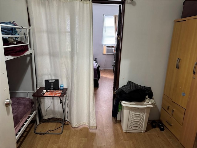 bedroom with wood finished floors