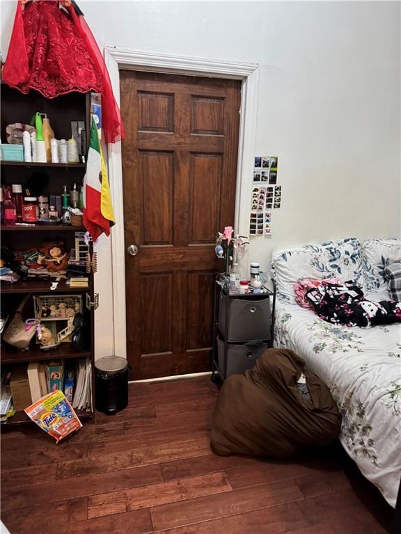 bedroom with hardwood / wood-style floors