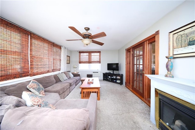115 Wilson Ter, Staten Island, NY 10304 - living area with light colored carpet, ceiling fan, and a glass covered fireplace