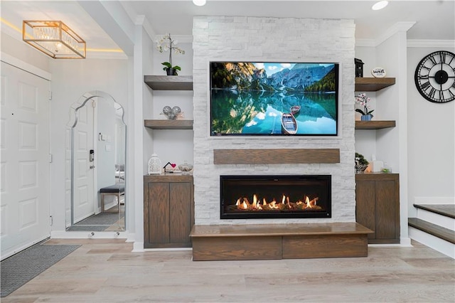 286 Bay 10th St, Brooklyn, NY 11228 - living area featuring crown molding, wood finished floors, built in shelves, a stone fireplace, and a chandelier
