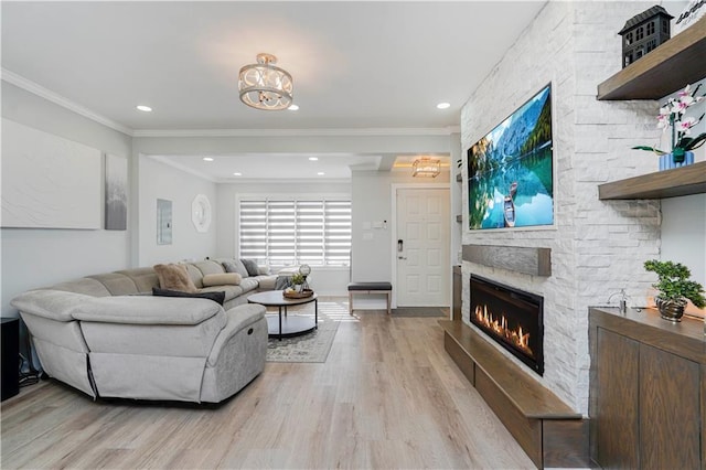 286 Bay 10th St, Brooklyn, NY 11228 - living room with light wood-type flooring, a fireplace, crown molding, a chandelier, and baseboards