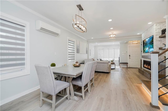 286 Bay 10th St, Brooklyn, NY 11228 - dining room with a wall mounted air conditioner, crown molding, light wood-style floors, baseboards, and a large fireplace