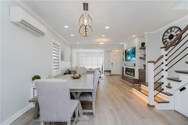 286 Bay 10th St, Brooklyn, NY 11228 - dining area with a wall unit AC, stairway, a large fireplace, crown molding, and light wood finished floors