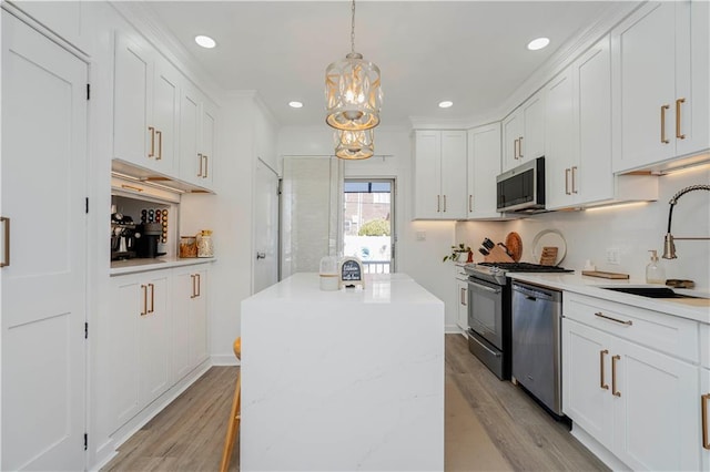 286 Bay 10th St, Brooklyn, NY 11228 - kitchen with a sink, stainless steel appliances, light wood-type flooring, a kitchen island, and recessed lighting