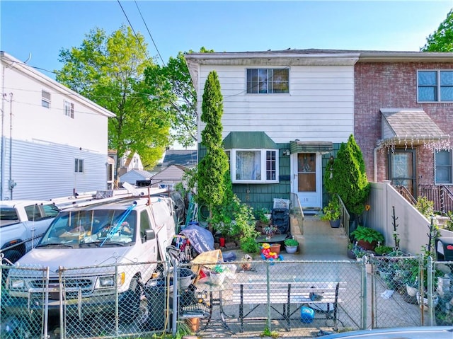 18 Downey Pl, Staten Island, NY 10303 - townhome / multi-family property with a fenced front yard and a gate