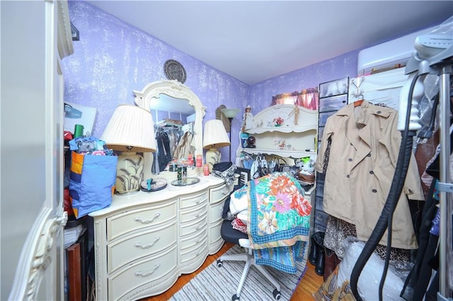 18 Downey Pl, Staten Island, NY 10303 - bedroom featuring wood finished floors and an AC wall unit