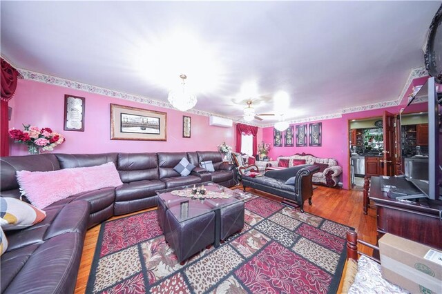 18 Downey Pl, Staten Island, NY 10303 - living area featuring wood finished floors, a wall mounted AC, and ceiling fan