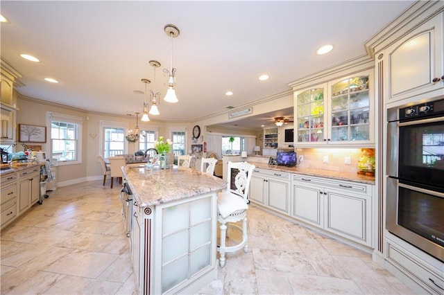 kitchen with double oven, recessed lighting, decorative backsplash, and crown molding