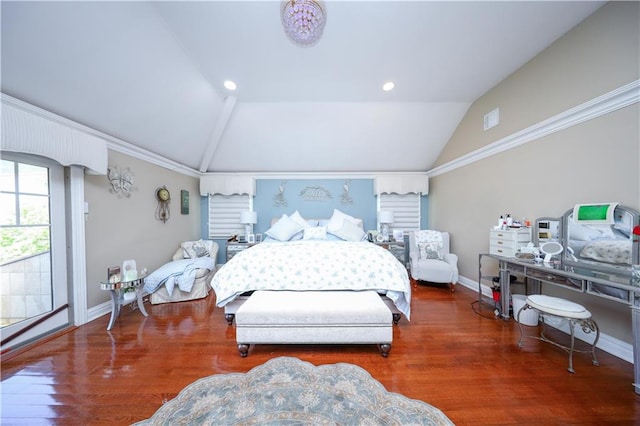 bedroom featuring visible vents, baseboards, lofted ceiling, and wood finished floors