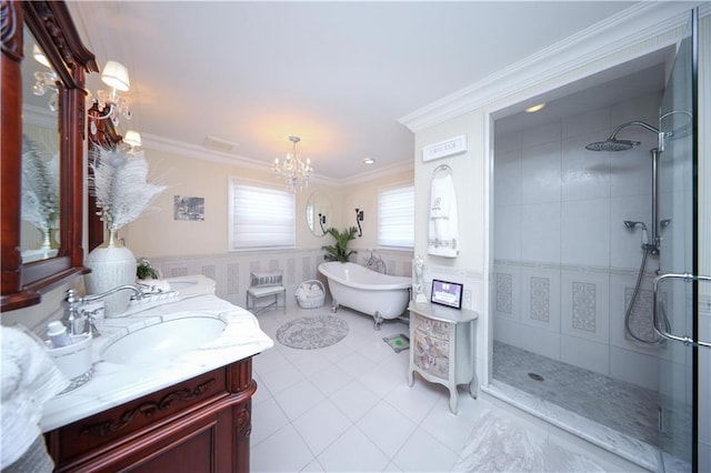 bathroom with tile patterned flooring, a freestanding bath, a stall shower, and a chandelier