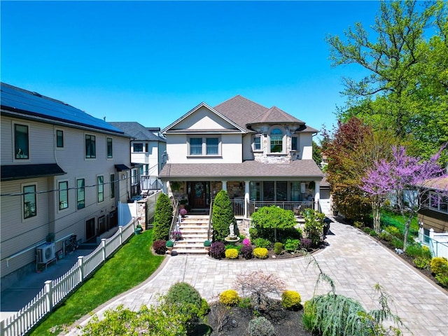 63 Finlay Ave, Staten Island, NY 10309 - view of front of property with covered porch, stairway, and stucco siding