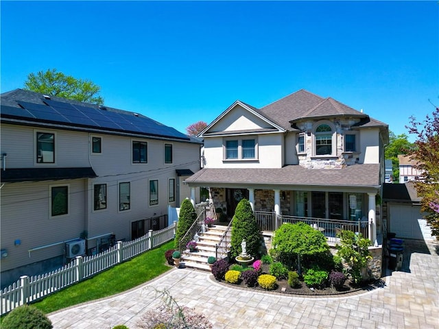 63 Finlay Ave, Staten Island, NY 10309 - view of front of home featuring a porch, stucco siding, and a garage