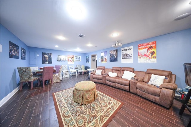 living room with recessed lighting, visible vents, and dark wood finished floors