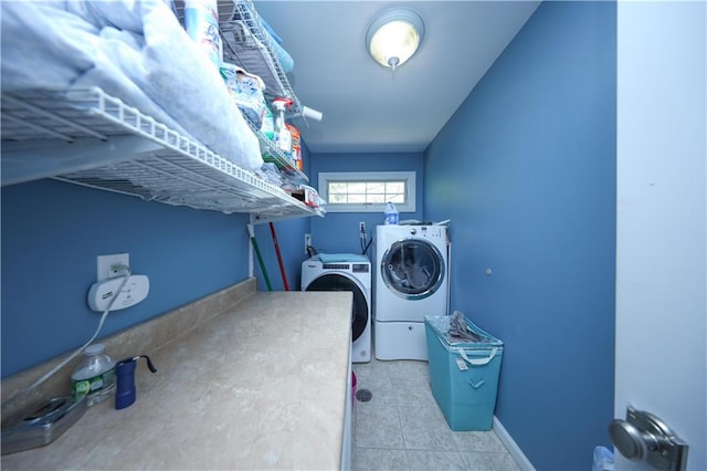 clothes washing area featuring laundry area and independent washer and dryer