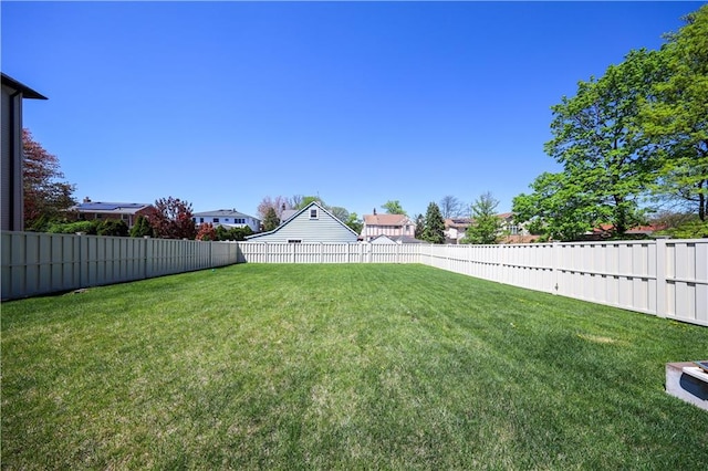 view of yard with a fenced backyard