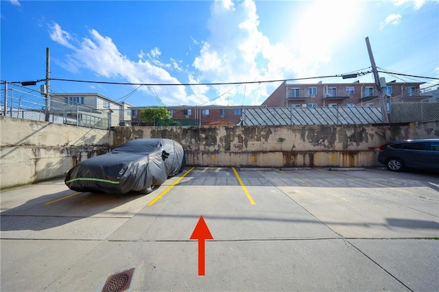 uncovered parking lot with fence