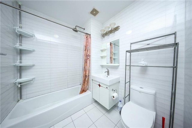 full bath featuring visible vents, vanity, shower / bath combo with shower curtain, toilet, and tile patterned floors